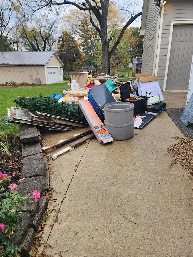 Dumpster being loaded with debris for 3 Yard Dumpster Rental in Haughton